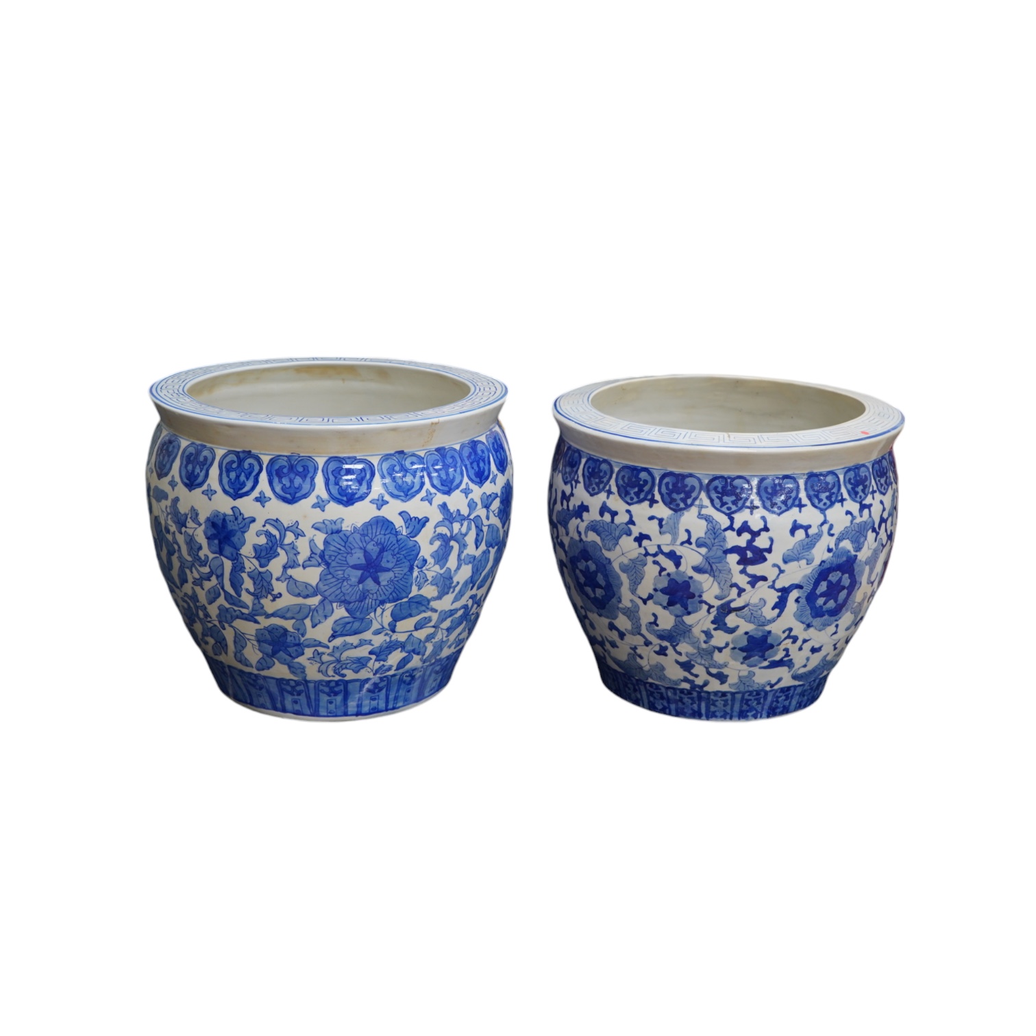 Two Chinese blue and white jardinieres, 31cm high. Condition - fair